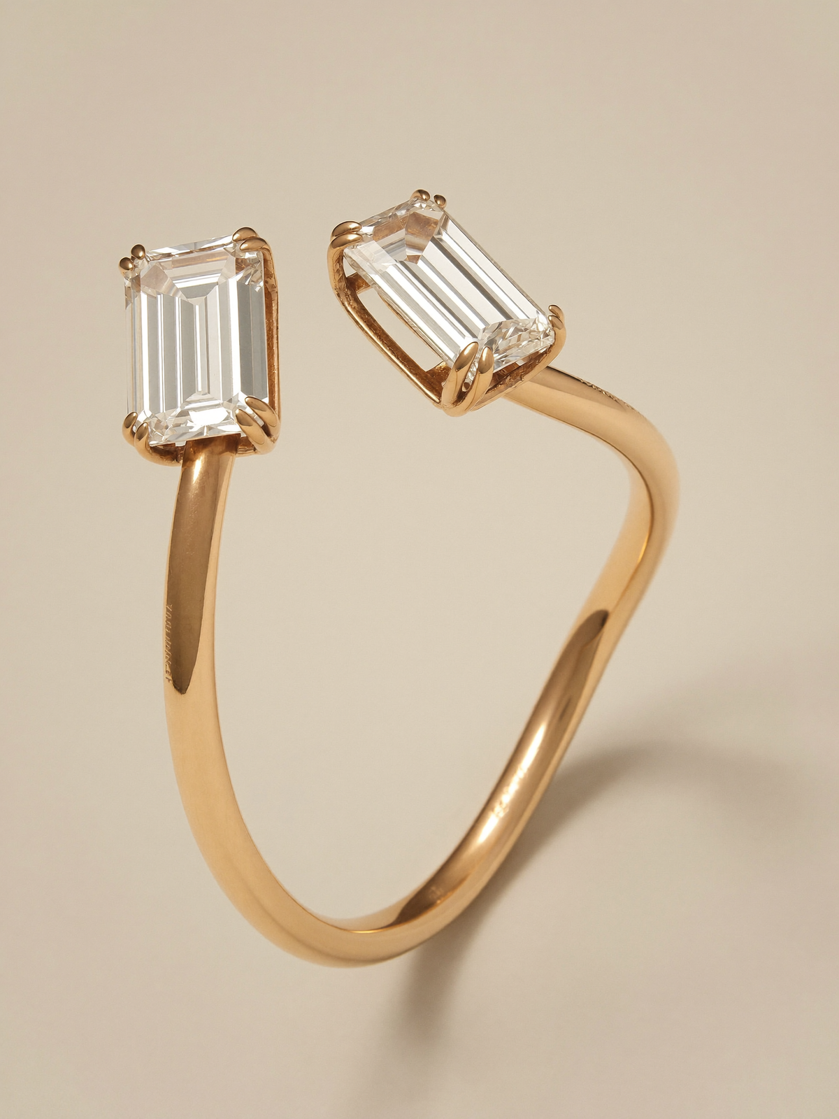 Design concept: The Contour Bangle, an open bangle ending in two emerald-cut stones