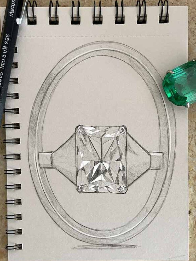 A pencil drawing of a ring with an emerald-cut stone